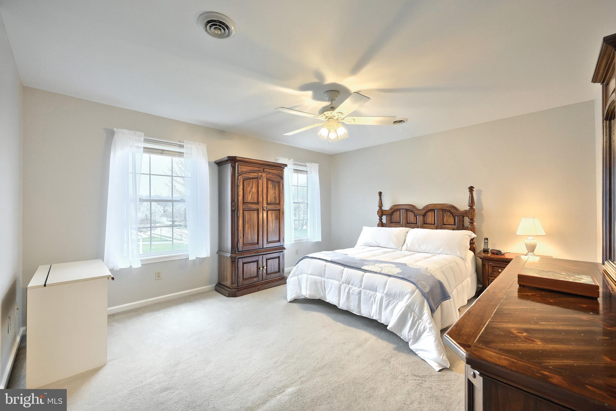 70 Test Road Hanover, PA 17331 - Photo 20 of 39 a bedroom with a large bed and a chandelier