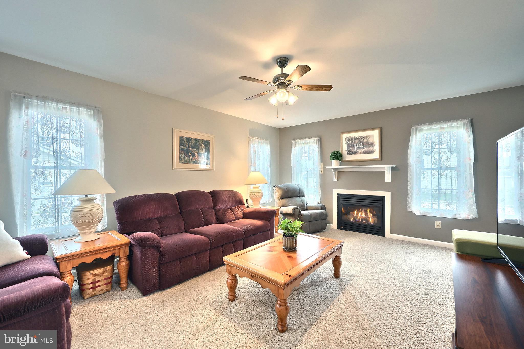 70 Test Road Hanover, PA 17331 - Photo 9 of 39 a living room with furniture a fireplace and a large window