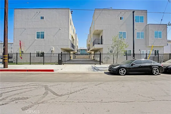 a view of a car parked in front of a building