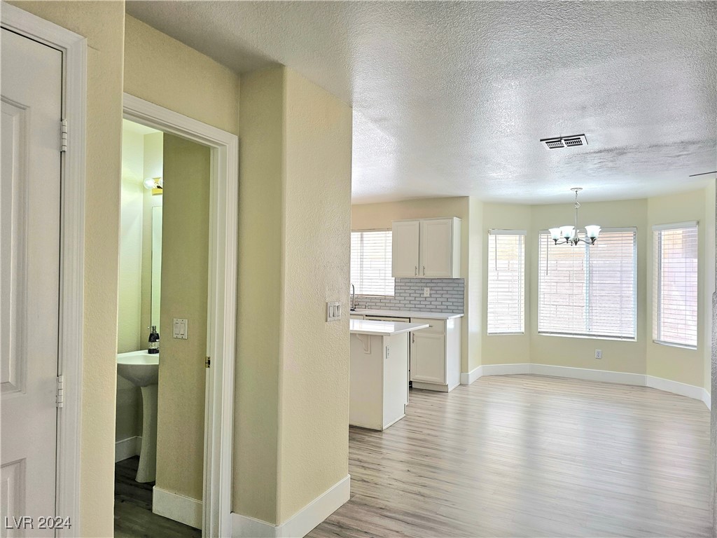 1968 Flagstone Ranch Lane Henderson, NV 89012 - Photo 39 of 53 Powder room to Dining room