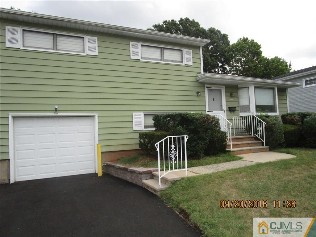 9 Baldwin Road Edison, NJ 08817 - Photo 1 of 8 a view of a house with a small yard and a large space
