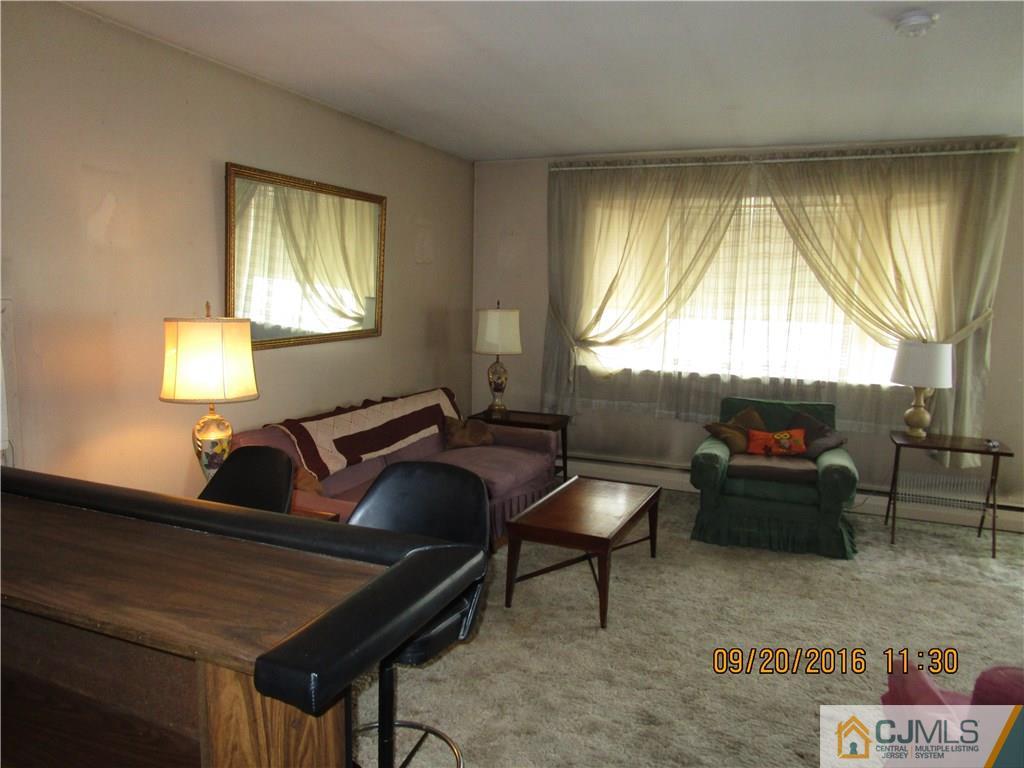 9 Baldwin Road Edison, NJ 08817 - Photo 3 of 8 a living room with furniture and a window