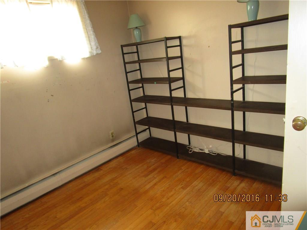 9 Baldwin Road Edison, NJ 08817 - Photo 6 of 8 a view of a room with racks on the wall