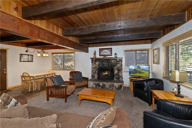 a kitchen with a sink a refrigerator and cabinets