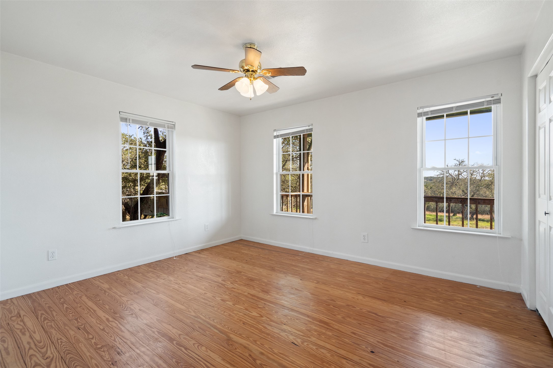 1401 Pursley Road Dripping Springs, TX 78620 - Photo 15 of 35 Bedroom with hardwood / wood-style floors and ceiling fan