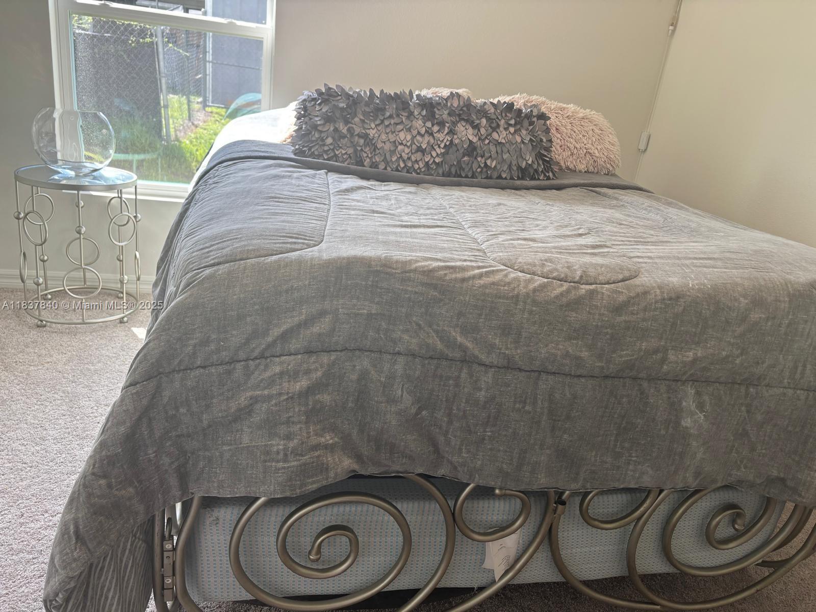 1073 Southwest Eureka Avenue, Unit 1073 Port St. Lucie, FL 34953 - Photo 18 of 25 a bedroom with a sink and a toilet