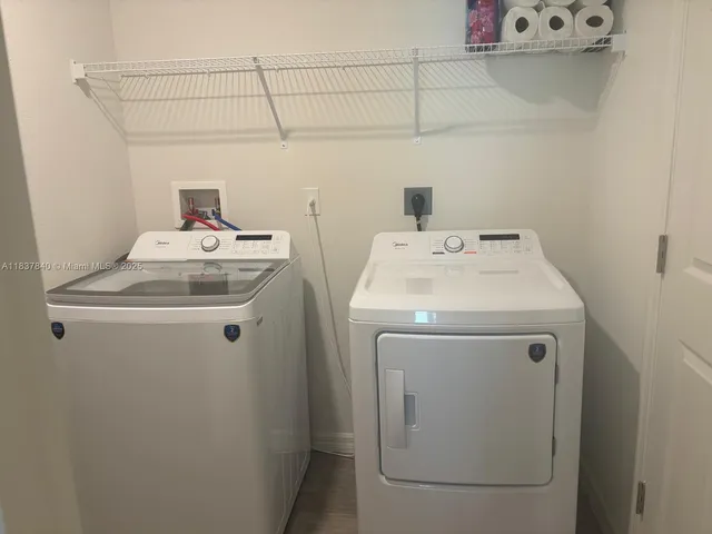 a utility room with dryer and washer