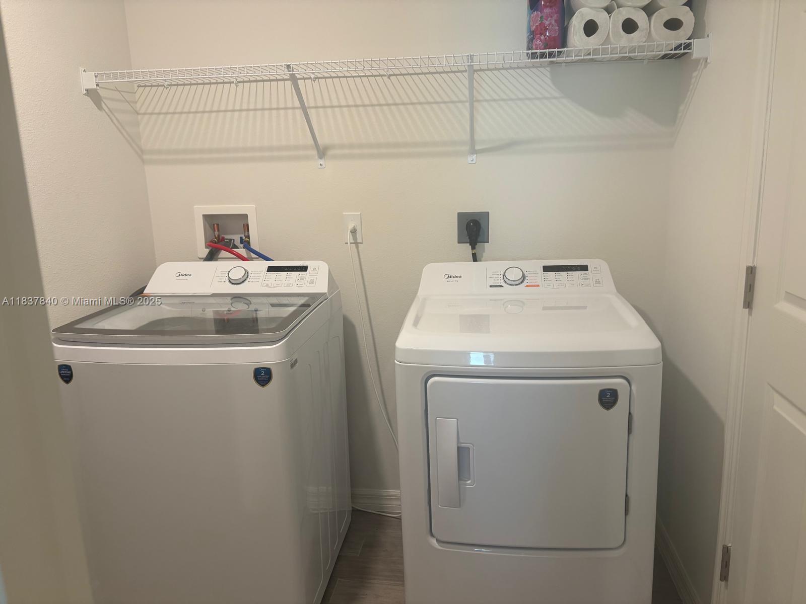 1073 Southwest Eureka Avenue, Unit 1073 Port St. Lucie, FL 34953 - Photo 23 of 25 a utility room with dryer and washer
