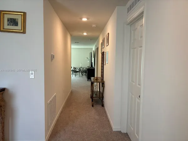 a view of hallway with livingroom