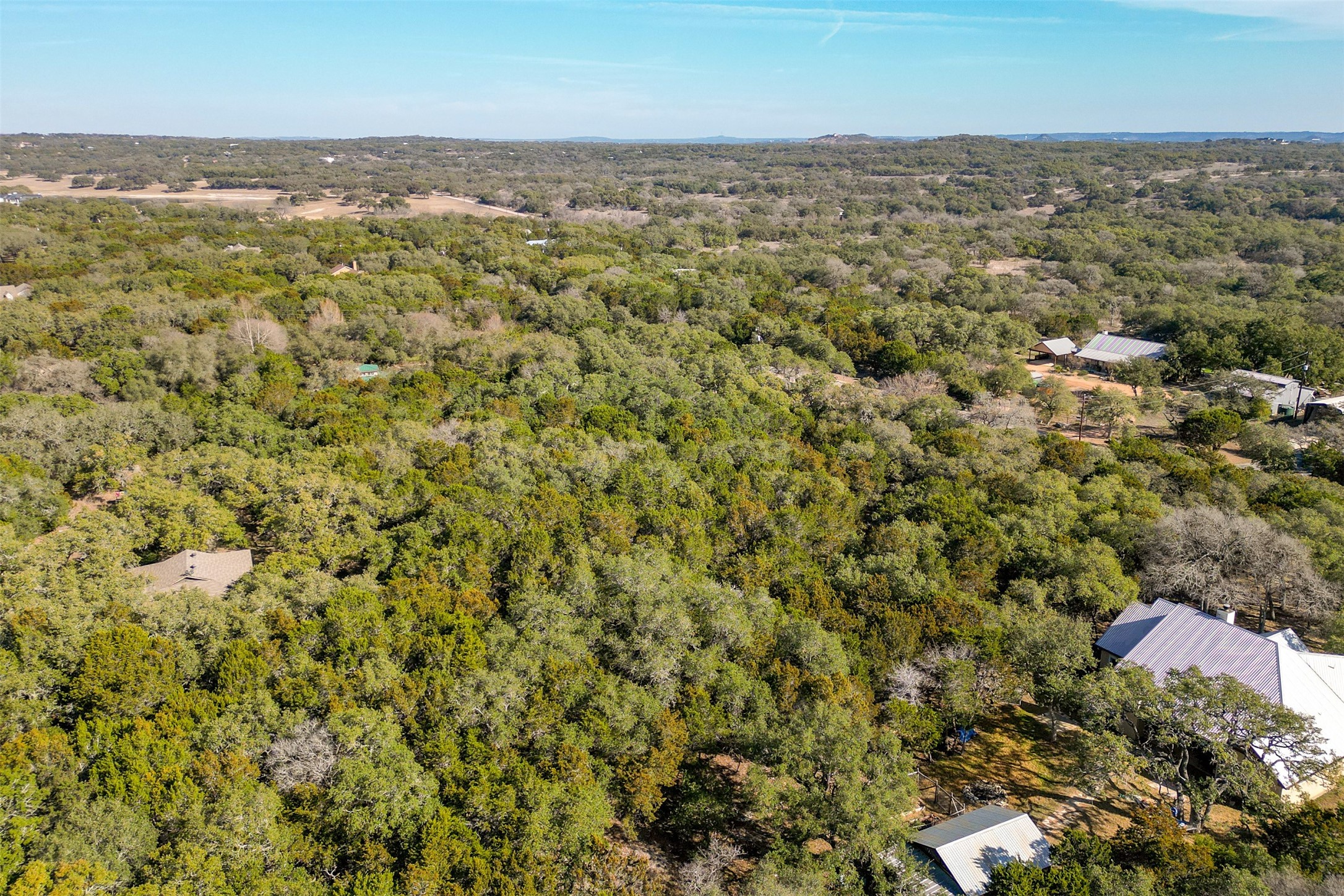 Lot 59 Ridge Oak Drive Wimberley, TX 78676 - Photo 25 of 30 an aerial view of residential houses with outdoor space and trees