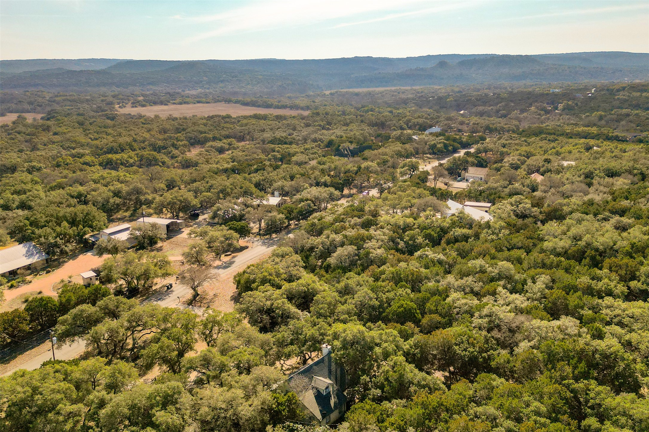Lot 59 Ridge Oak Drive Wimberley, TX 78676 - Photo 28 of 30 an aerial view of residential houses with outdoor space and trees