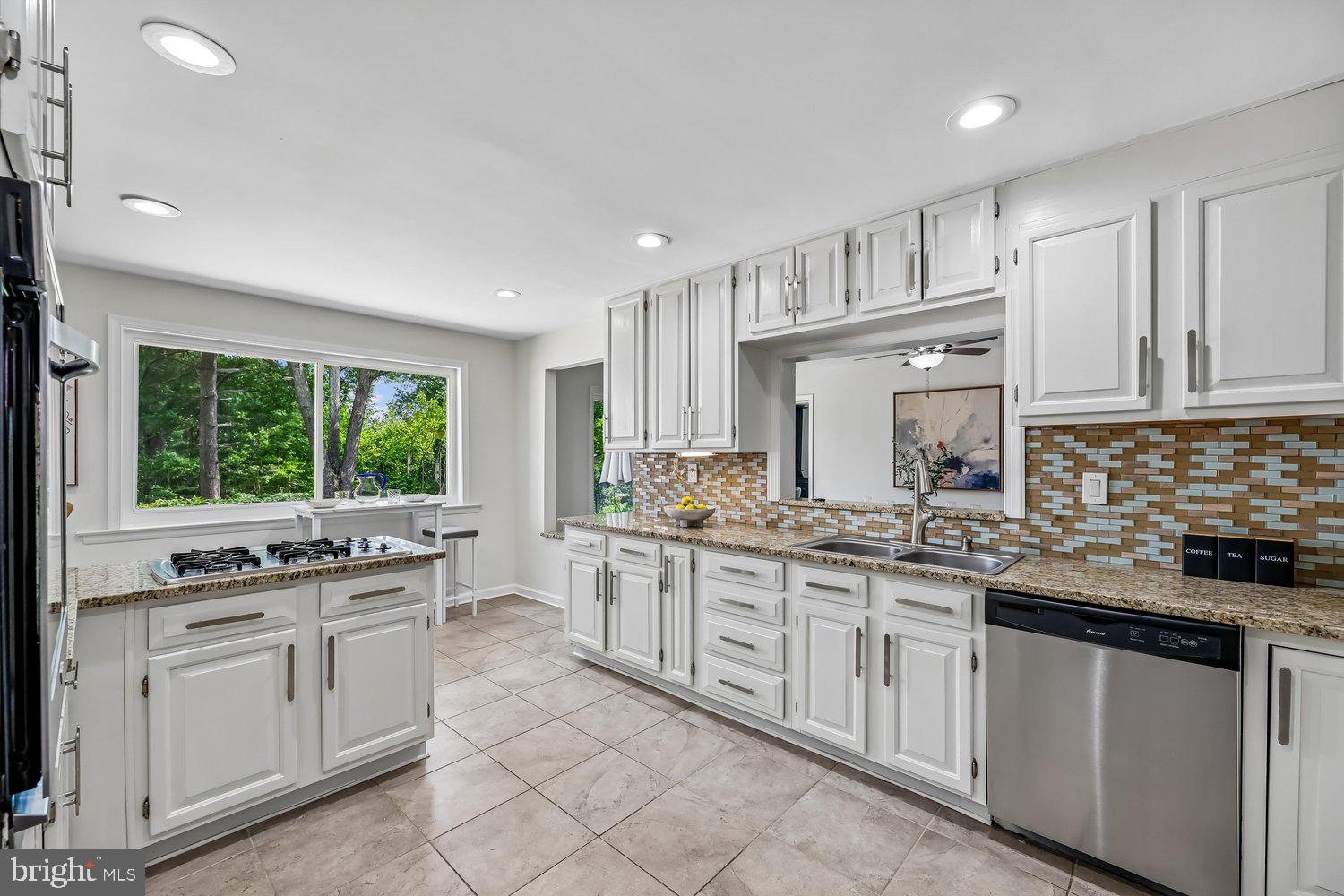 300 Gilsan Court Silver Spring, MD 20902 - Photo 2 of 117 a kitchen with stainless steel appliances granite countertop a stove a sink and a refrigerator