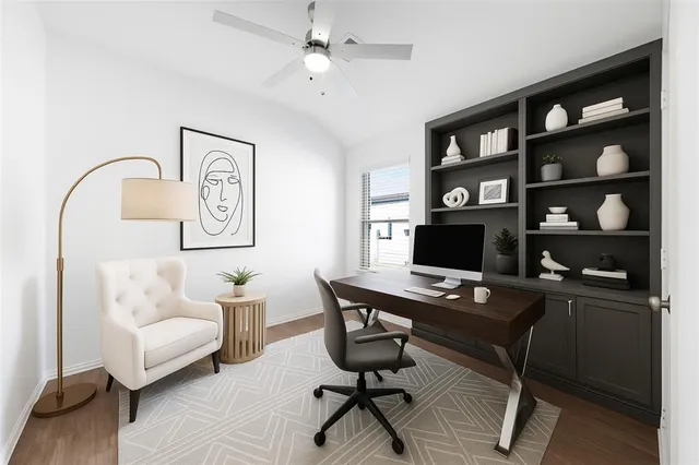 a workspace with a couch and a bookshelf