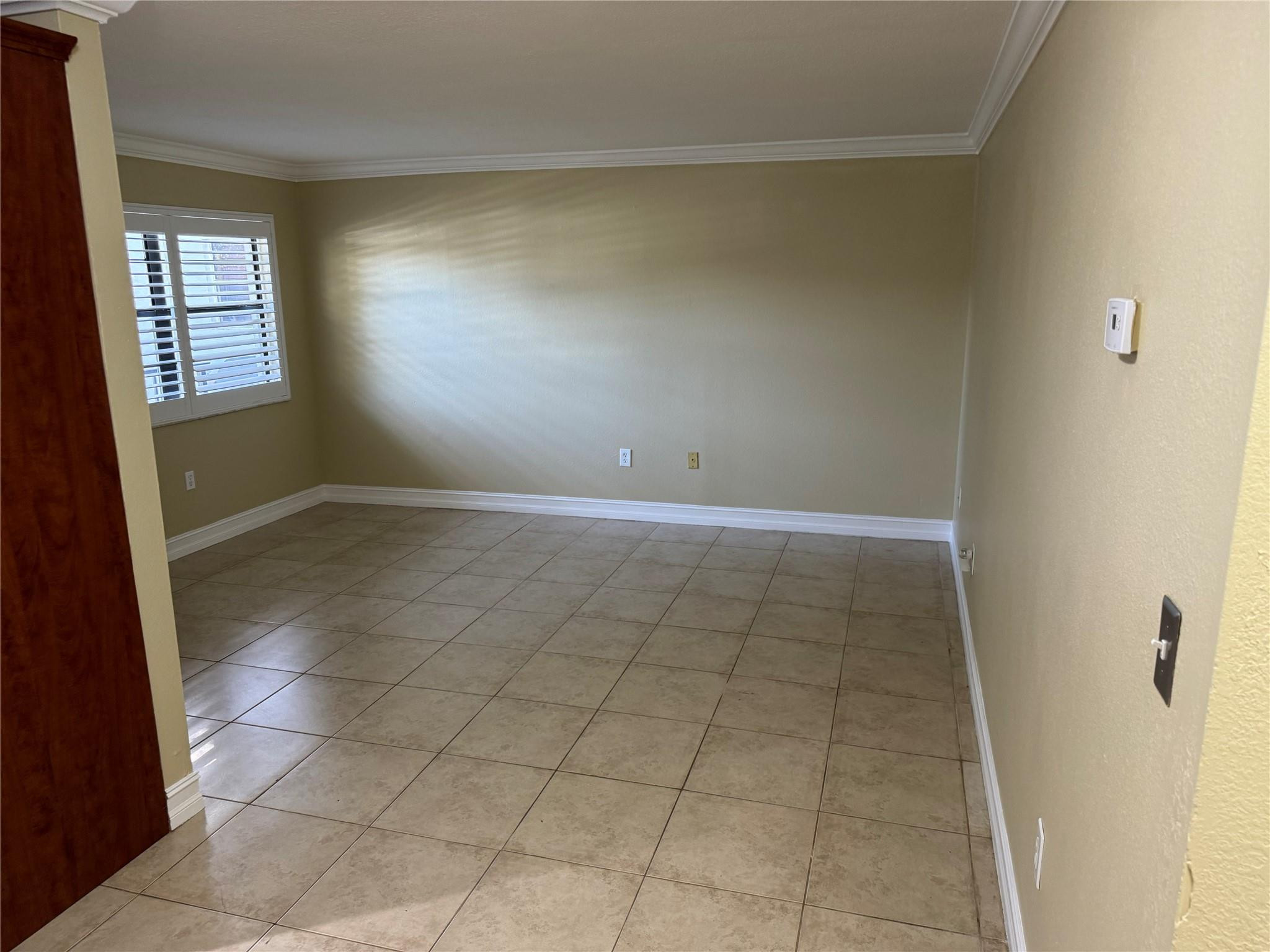 1925 Madison Street, Unit 21 Hollywood, FL 33020 - Photo 4 of 10 an empty room with windows