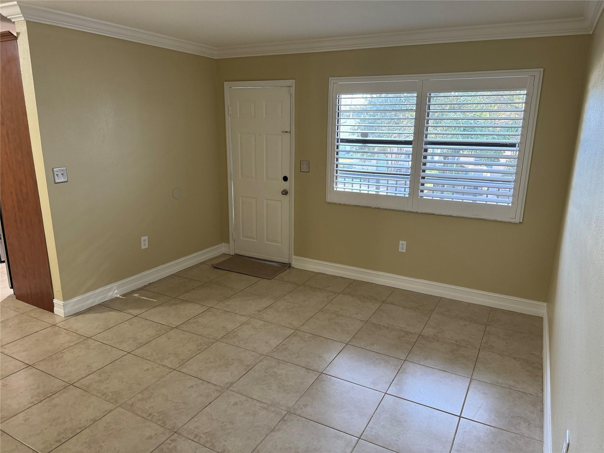 1925 Madison Street, Unit 21 Hollywood, FL 33020 - Photo 6 of 10 an empty room with windows