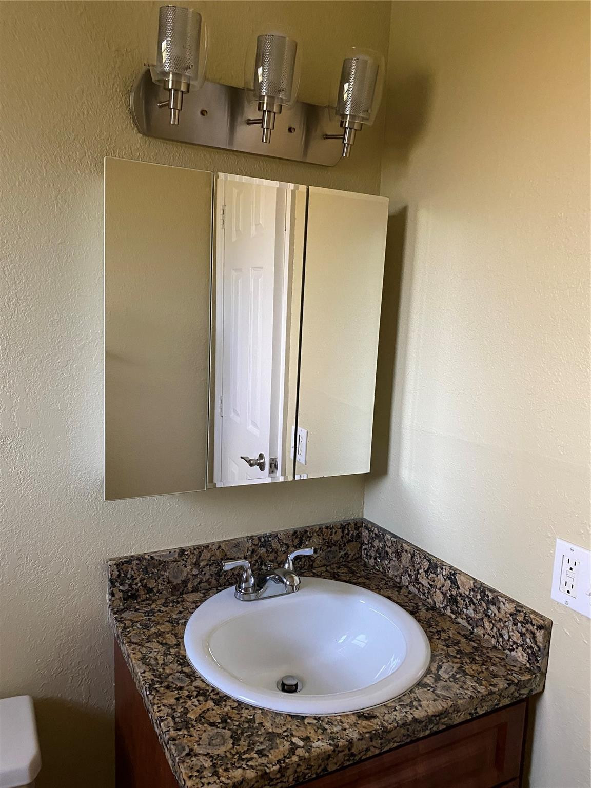 1925 Madison Street, Unit 21 Hollywood, FL 33020 - Photo 10 of 10 a bathroom with a sink and a mirror