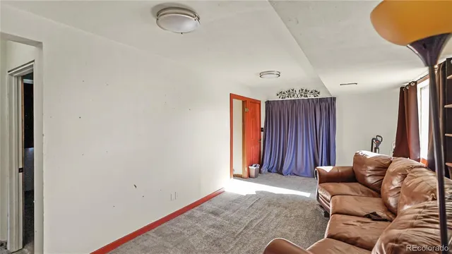 a view of room with furniture and a window