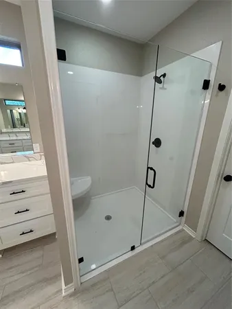 a bathroom with a double vanity sink and mirror
