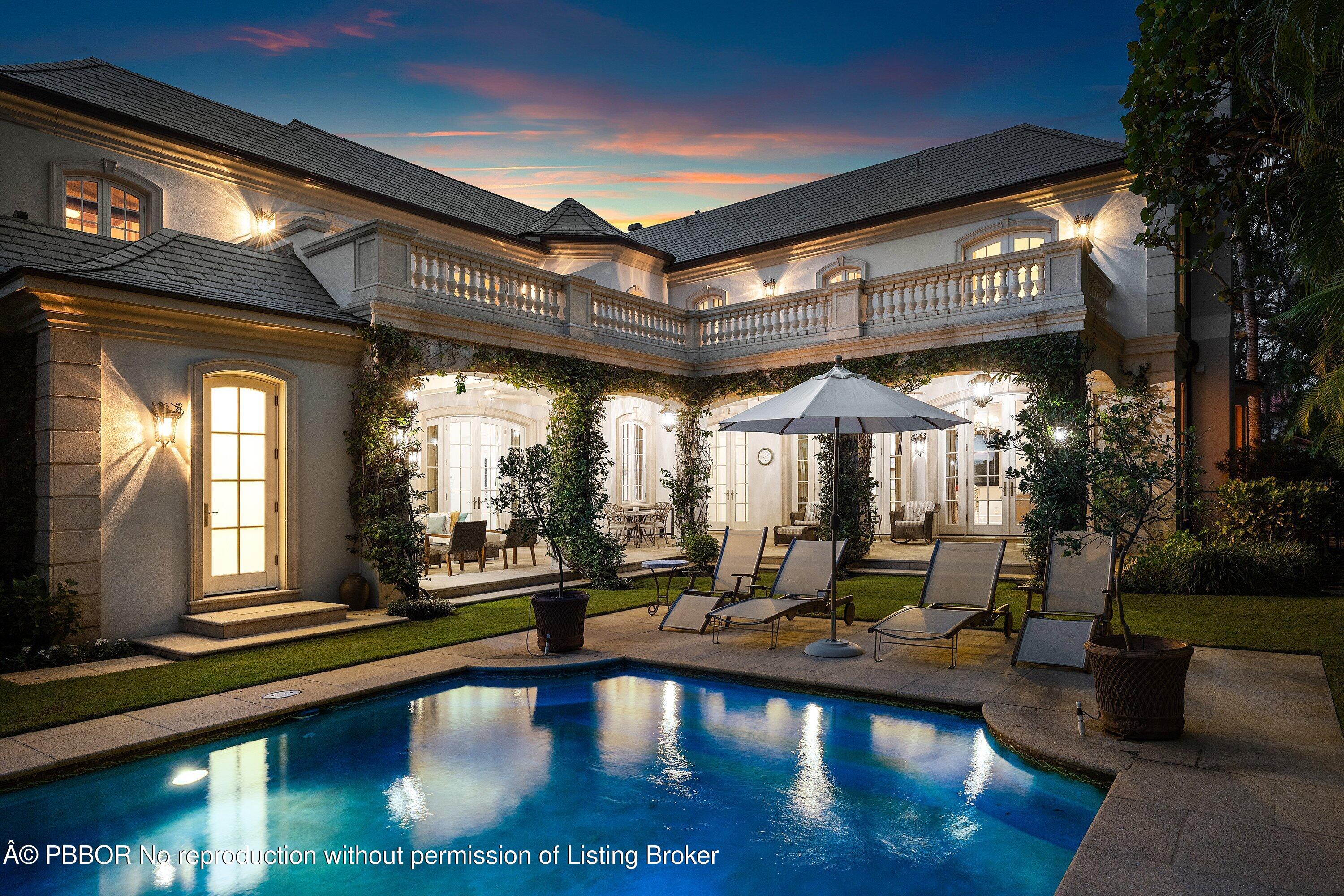 242 Wells Road Palm Beach, FL 33480 - Photo 48 of 54 a view of a patio with swimming pool table and chairs