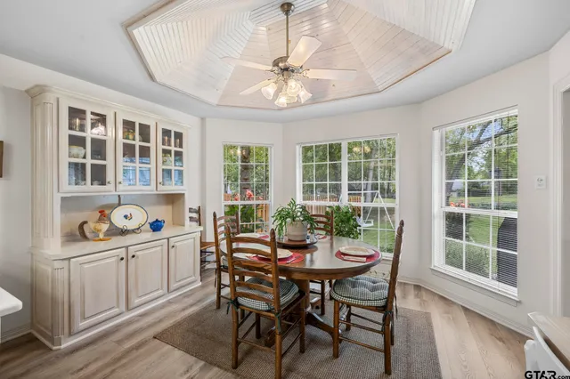 a view of a dining room that has a table and chairs in it