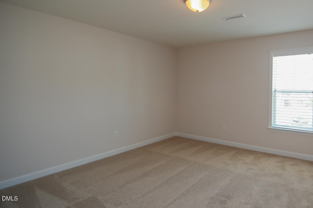 1803 Grandmaster Way Wake Forest, NC 27587 - Photo 20 of 26 an empty room with a window