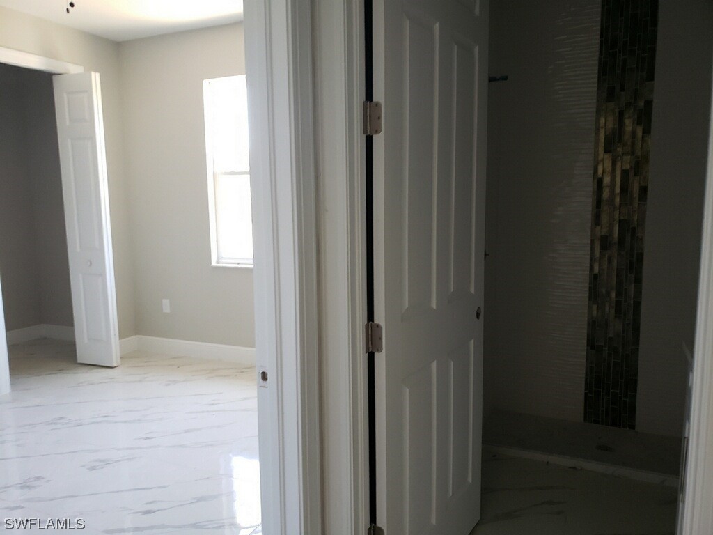 2715 50th Street Southwest Lehigh Acres, FL 33976 - Photo 11 of 16 a view of hallway with window