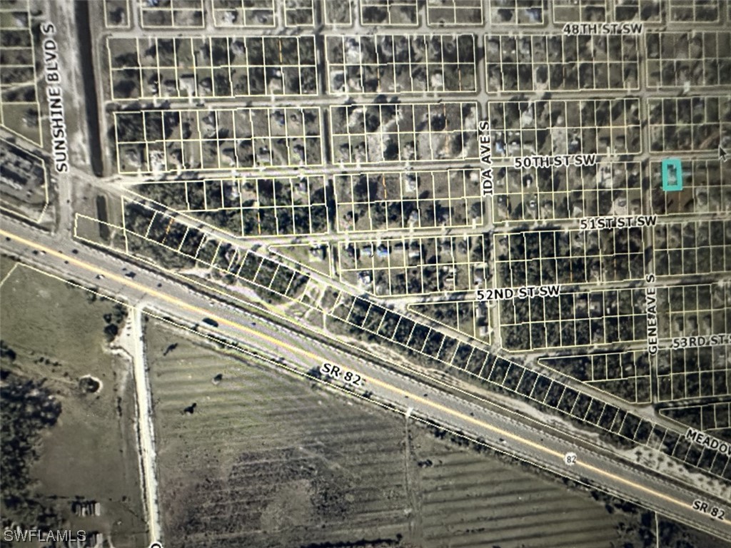 2715 50th Street Southwest Lehigh Acres, FL 33976 - Photo 16 of 16 a view of a balcony with a street