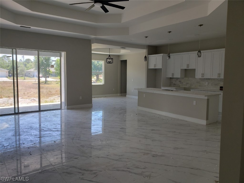 2715 50th Street Southwest Lehigh Acres, FL 33976 - Photo 3 of 16 a view of a kitchen with a sink and cabinets