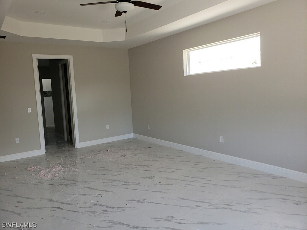 2715 50th Street Southwest Lehigh Acres, FL 33976 - Photo 7 of 16 a view of an empty room with a window
