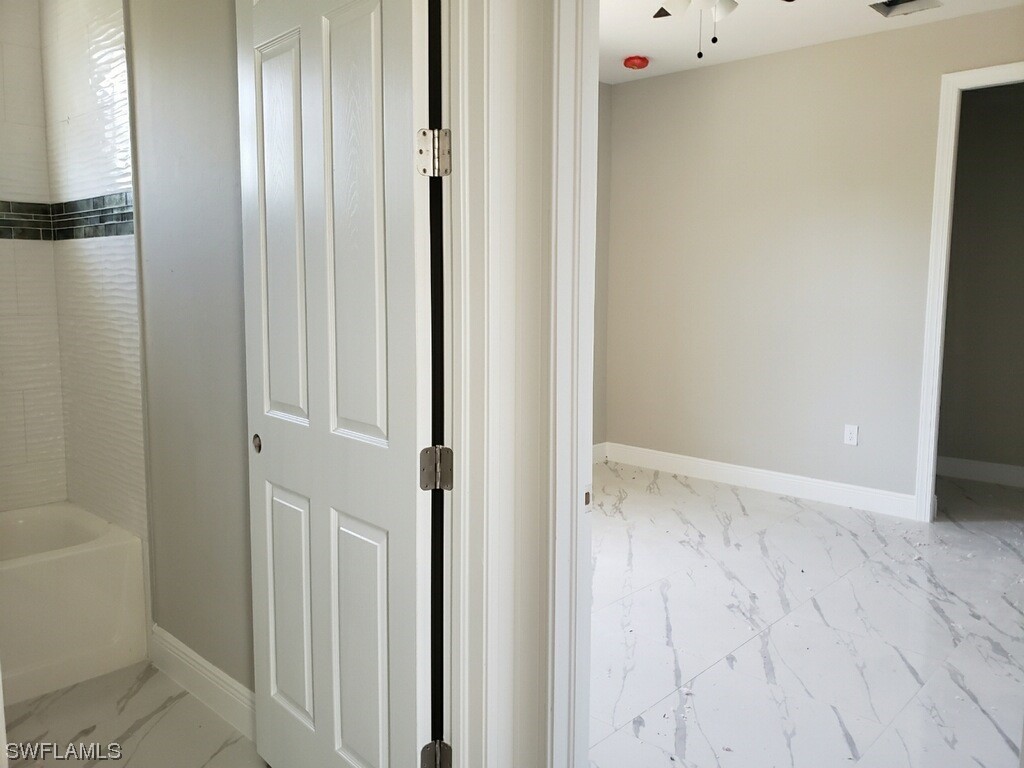 2715 50th Street Southwest Lehigh Acres, FL 33976 - Photo 9 of 16 a view of an empty room