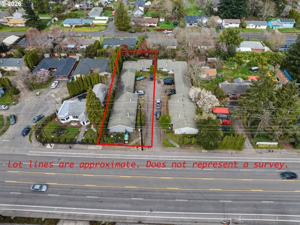 an aerial view of multiple houses with yard