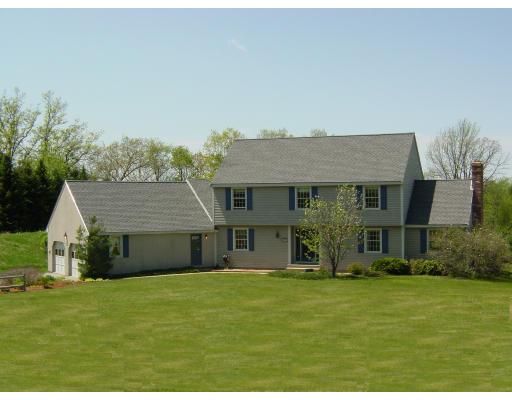 170 Still River Road Bolton, MA 01740 - Photo 1 of 15 a front view of a house with a garden and porch