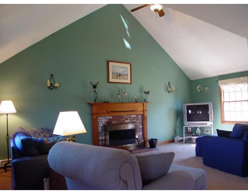 170 Still River Road Bolton, MA 01740 - Photo 3 of 15 a living room with furniture and a fireplace