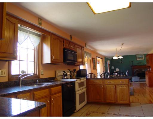 170 Still River Road Bolton, MA 01740 - Photo 5 of 15 a kitchen with a sink cabinets and window