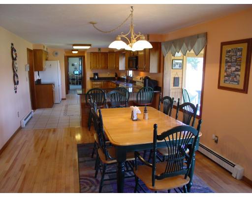 170 Still River Road Bolton, MA 01740 - Photo 6 of 15 a view of a dining room with furniture and chandelier