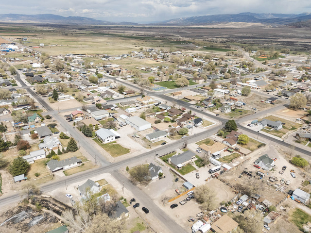 197 West 100 South Redmond, UT 84652 - Photo 39 of 41 Aerial view of property's location featuring a mountainous background and nearby suburban area