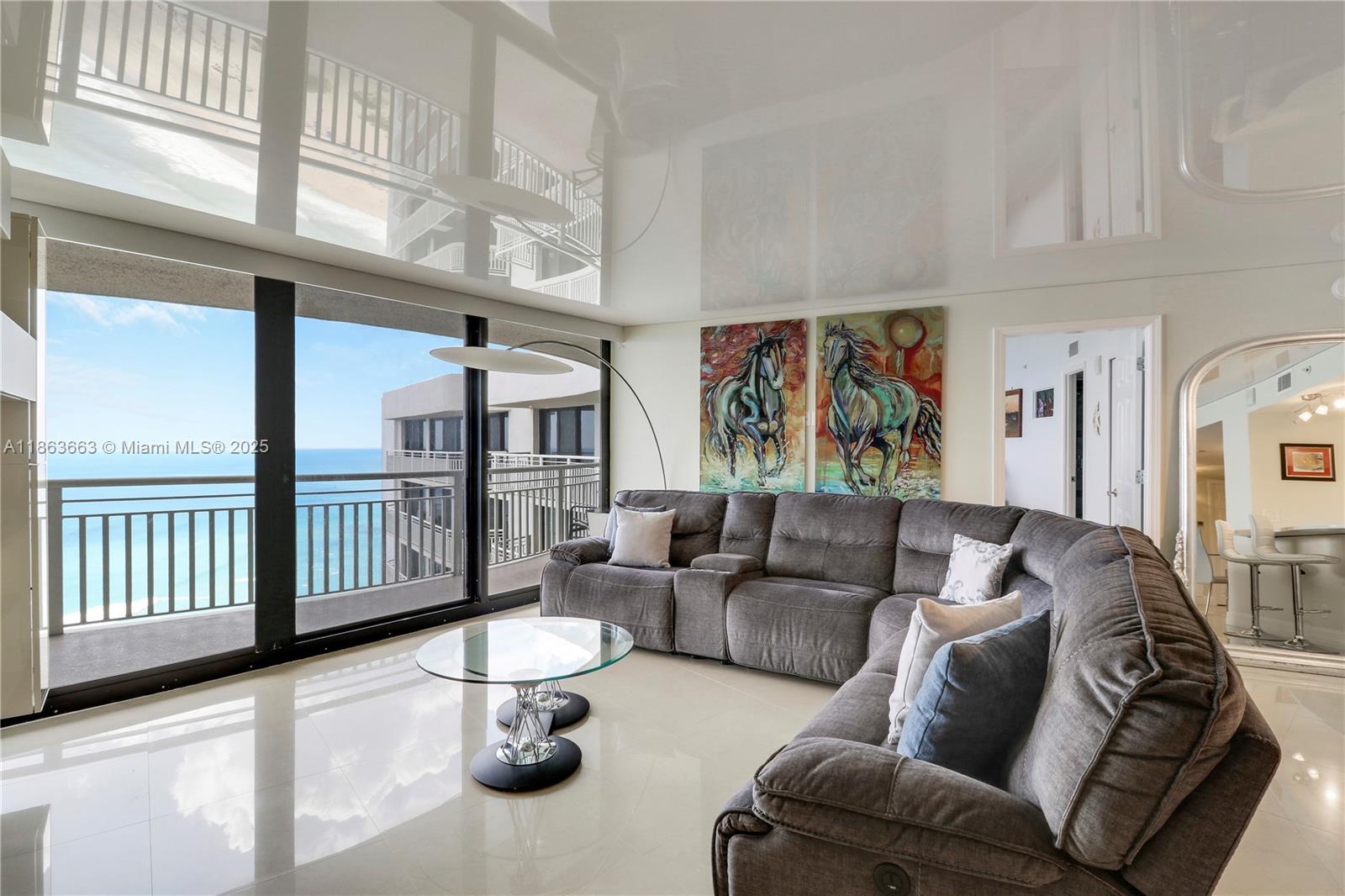 3000 North Ocean Drive, Unit PHD Singer Island, FL 33404 - Photo 30 of 97 a living room with furniture and a chandelier