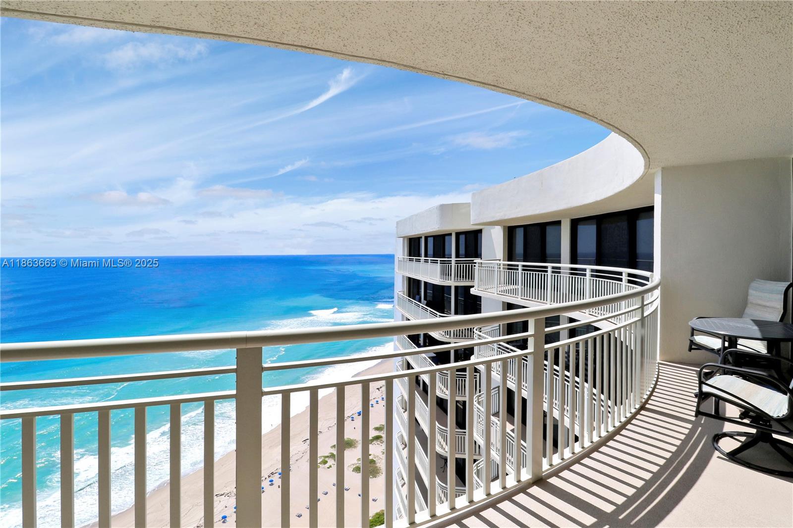 3000 North Ocean Drive, Unit PHD Singer Island, FL 33404 - Photo 37 of 97 a view of a chairs and table in the balcony
