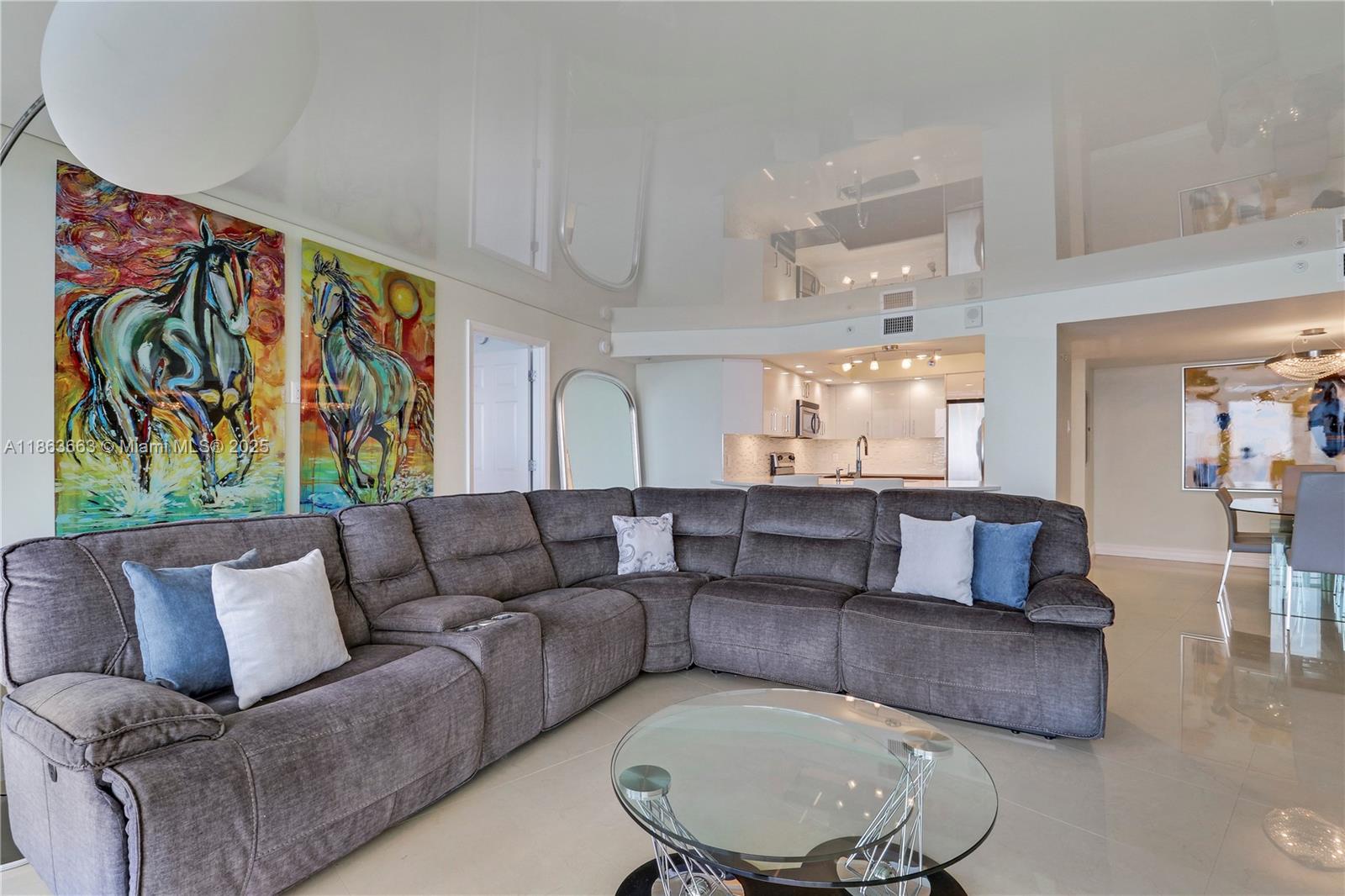 3000 North Ocean Drive, Unit PHD Singer Island, FL 33404 - Photo 40 of 97 a living room with furniture and a painting