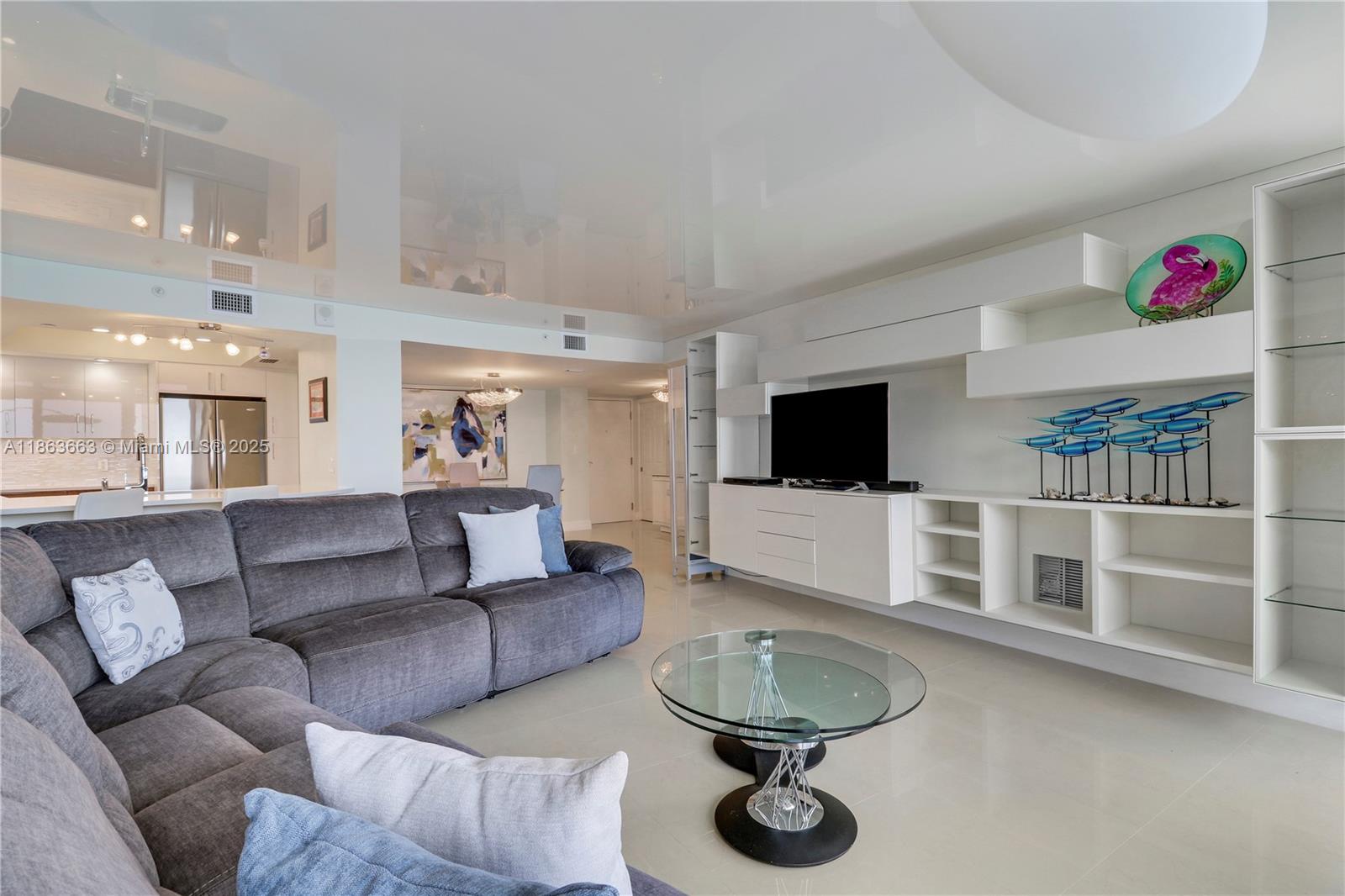 3000 North Ocean Drive, Unit PHD Singer Island, FL 33404 - Photo 41 of 97 a living room with furniture and a flat screen tv