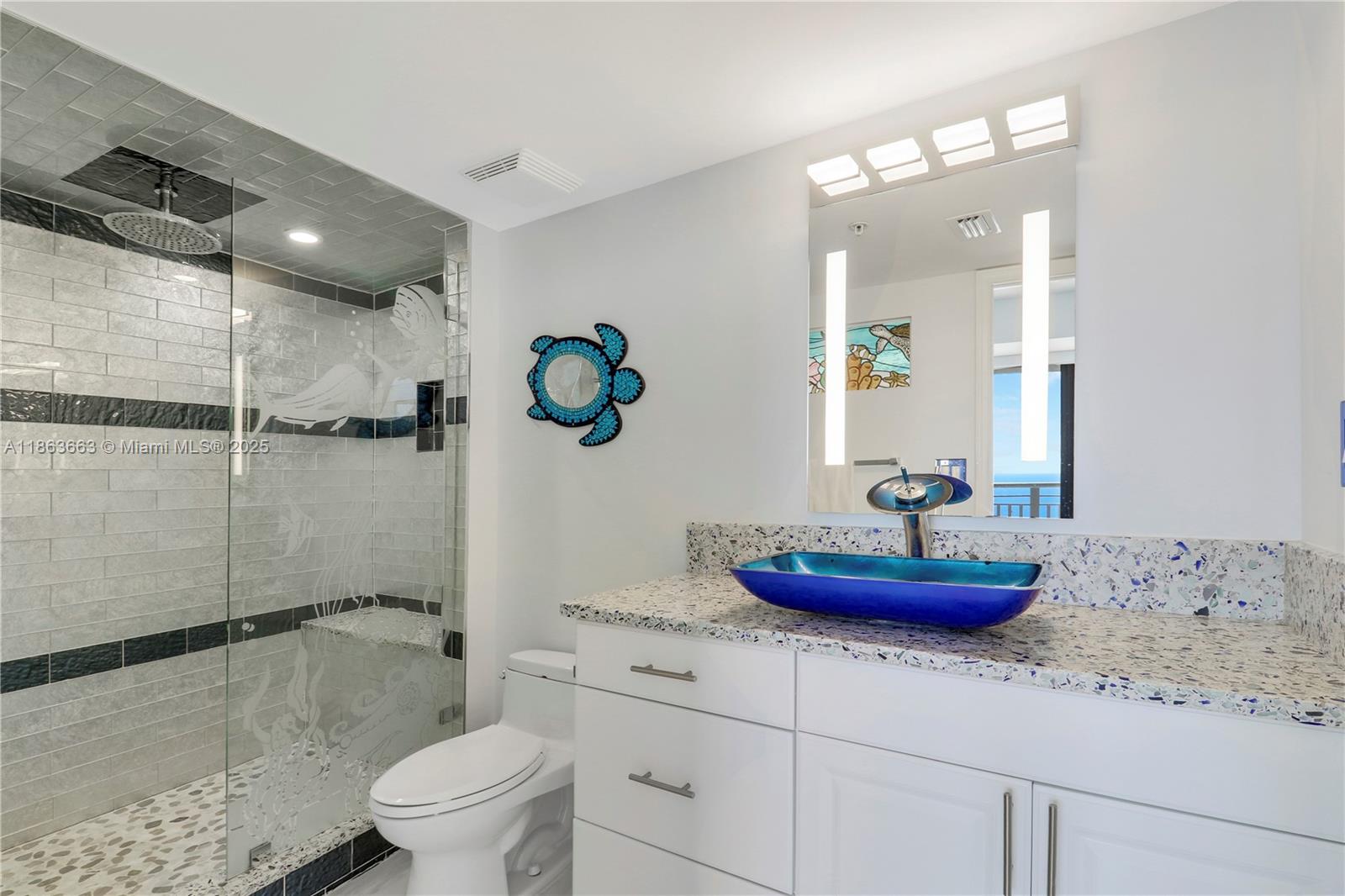 3000 North Ocean Drive, Unit PHD Singer Island, FL 33404 - Photo 48 of 97 a bathroom with a granite countertop sink a toilet and shower