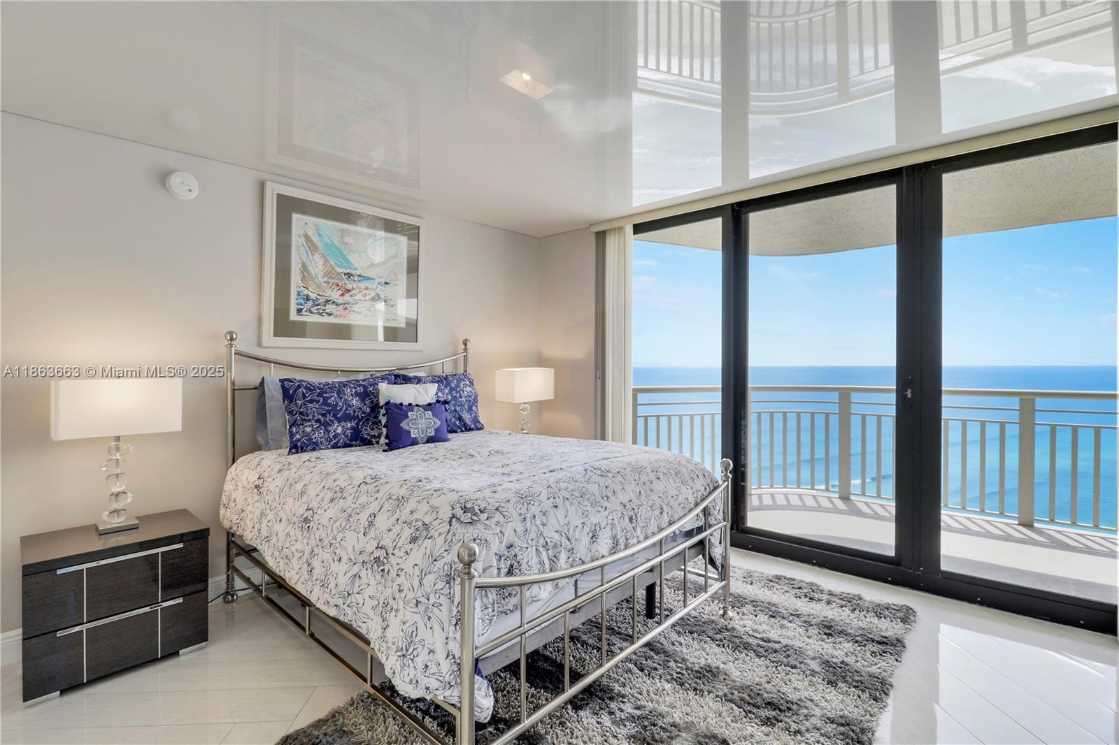 3000 North Ocean Drive, Unit PHD Singer Island, FL 33404 - Photo 52 of 97 a bedroom with a large bed and a night stand
