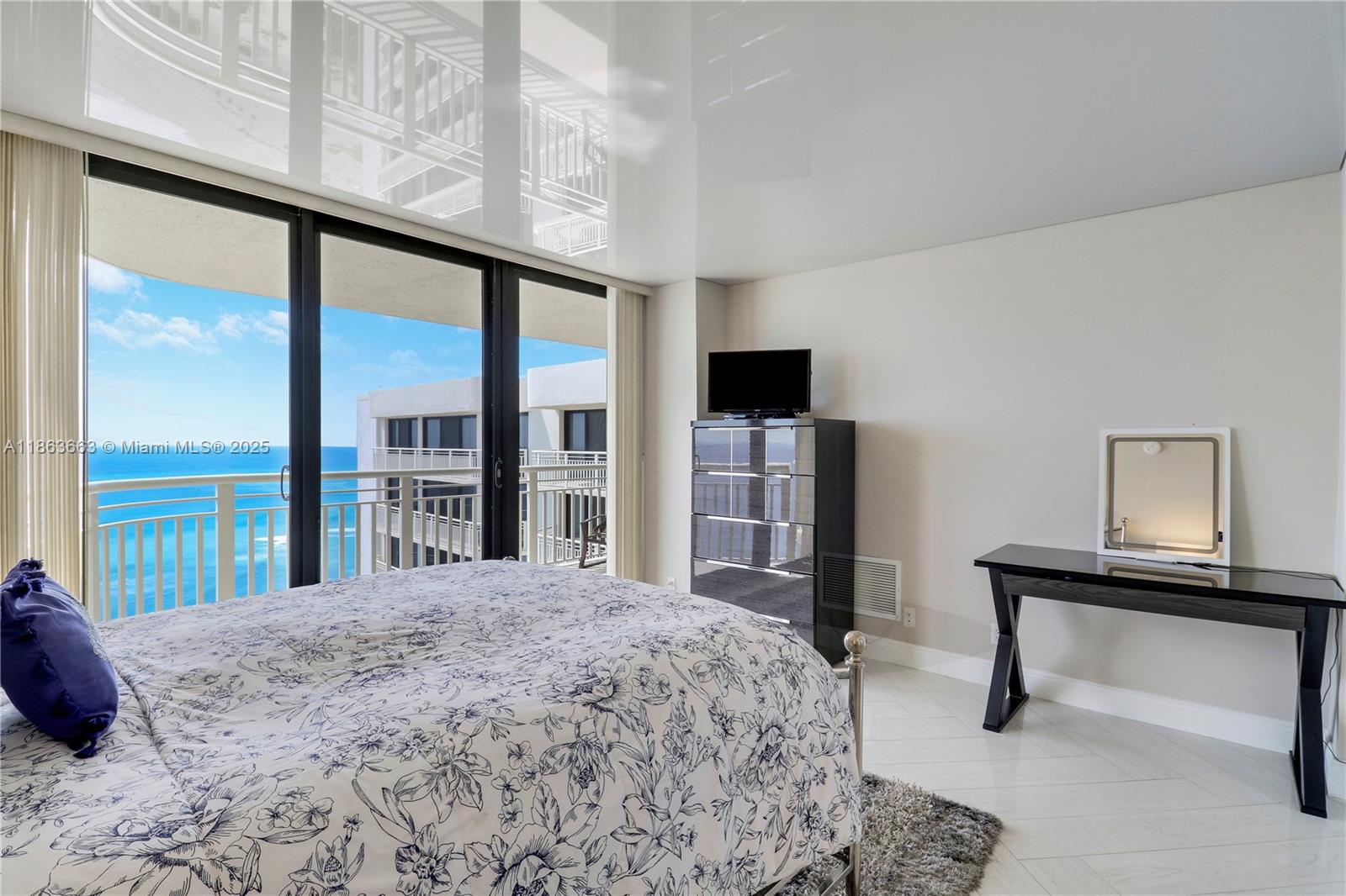 3000 North Ocean Drive, Unit PHD Singer Island, FL 33404 - Photo 53 of 97 a bedroom with a bed and a large window
