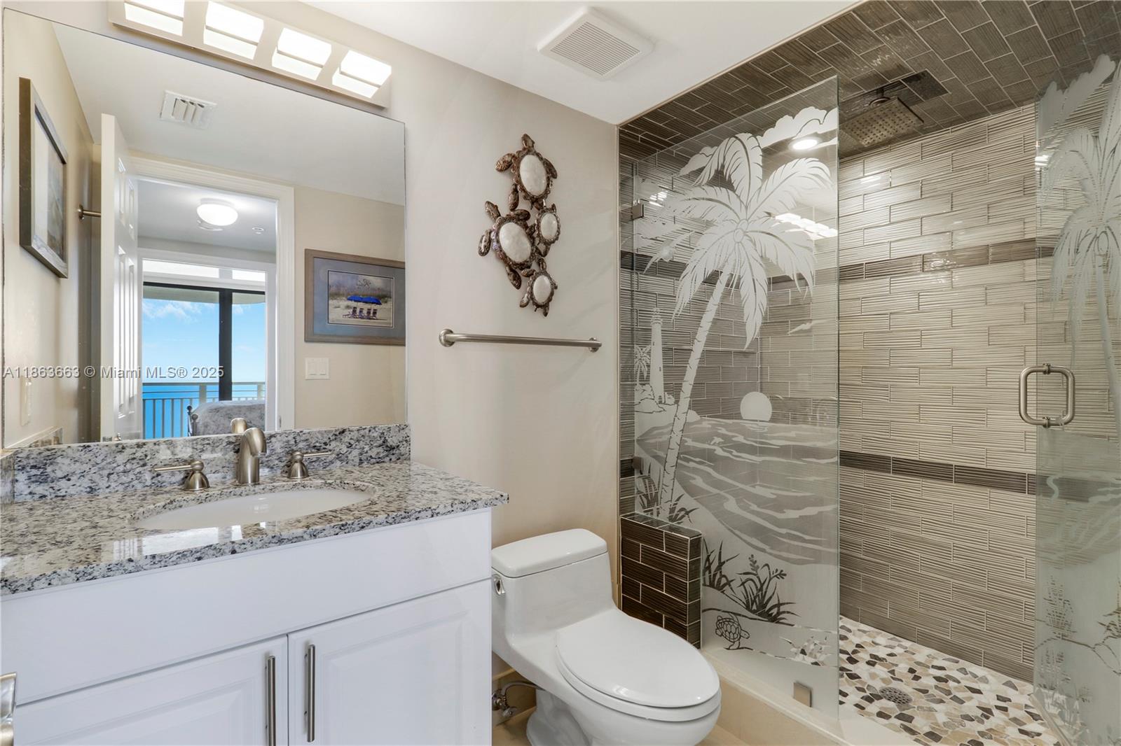 3000 North Ocean Drive, Unit PHD Singer Island, FL 33404 - Photo 56 of 97 a bathroom with a granite countertop sink a toilet and shower