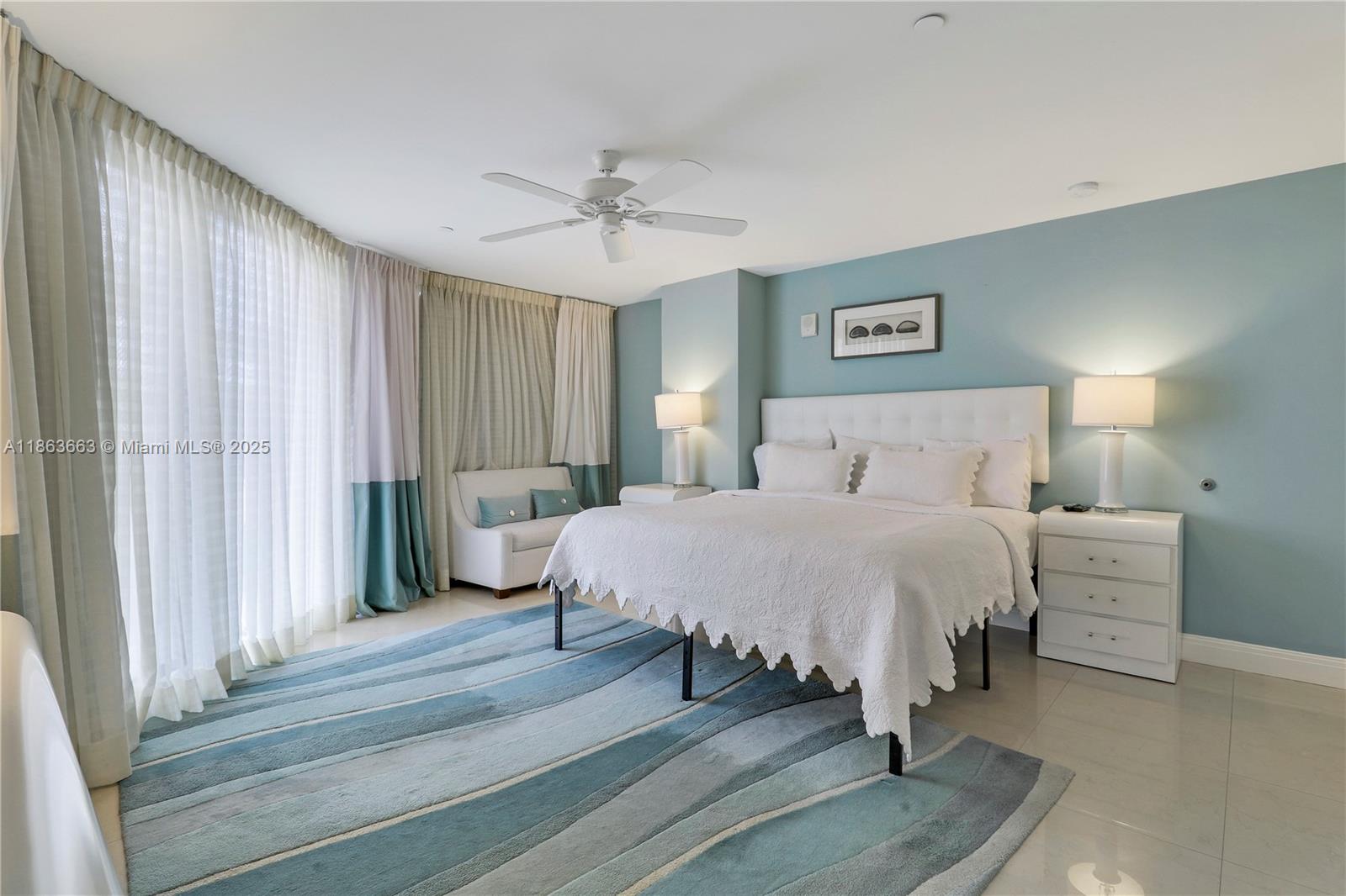 3000 North Ocean Drive, Unit PHD Singer Island, FL 33404 - Photo 70 of 97 a bedroom with a bed and a chandelier