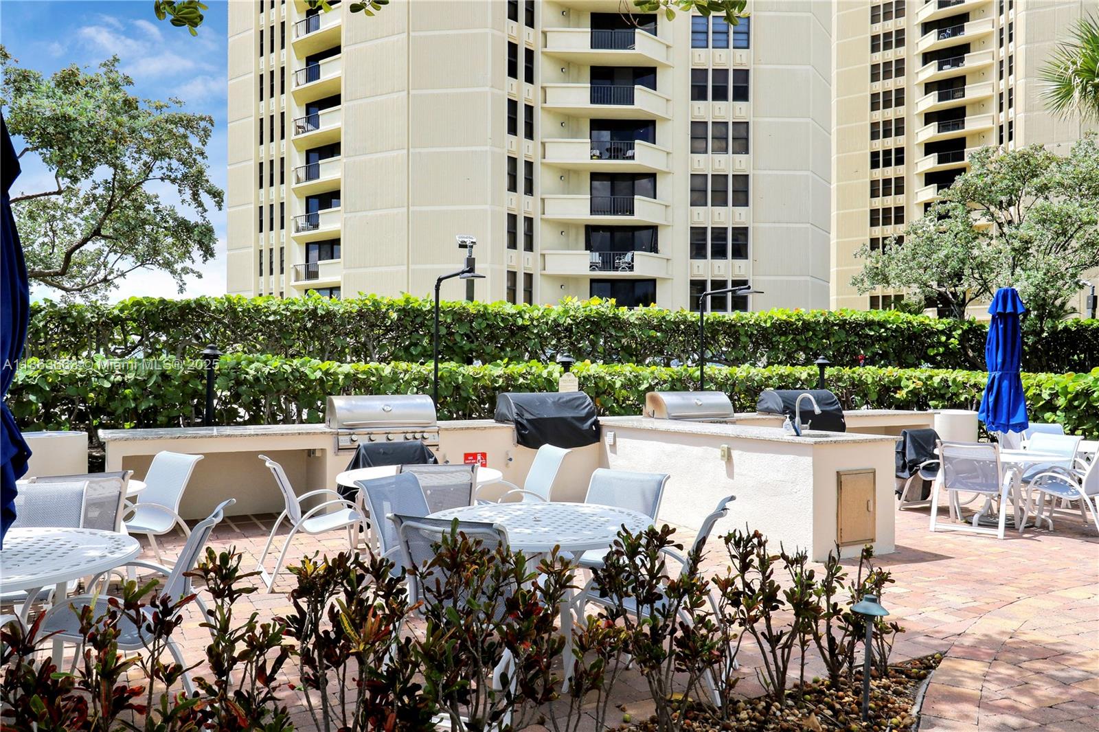 3000 North Ocean Drive, Unit PHD Singer Island, FL 33404 - Photo 81 of 97 a view of a patio with couches and table and chairs and potted plants