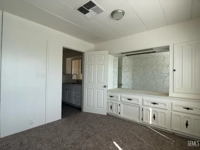 a view of a hallway with closet area