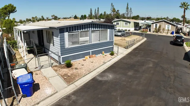a view of a house with wooden deck
