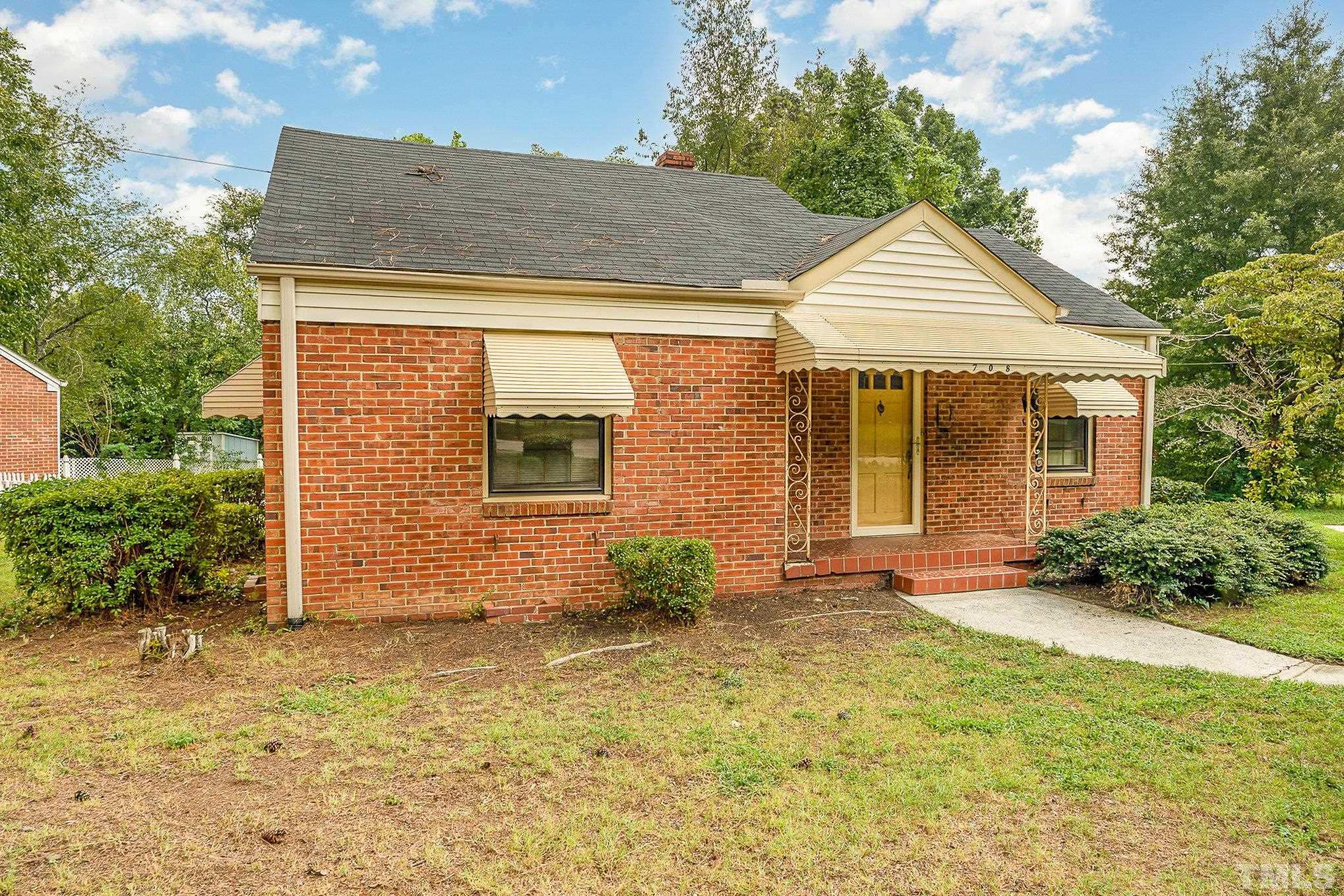 708 North King Charles Road Raleigh, NC 27610 - Photo 3 of 17 a view of a house with a yard