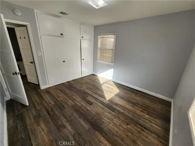 a view of hallway with wooden floor